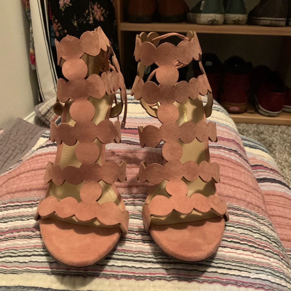 Pink sandals style heels.